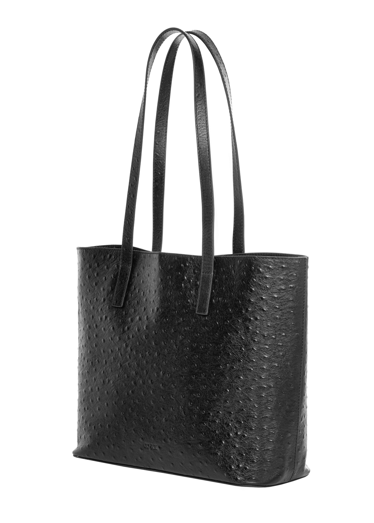 Czarna skórzana torebka damska shopper TORES-1389-9P(Z26), widok produktu skosem na białym tle.