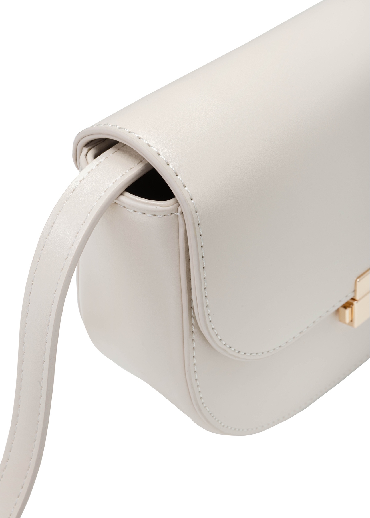 Kremowa półokrągła listonoszka damska TOREC-1127-0B(W26), zbliżenie na detal produktu na białym tle.