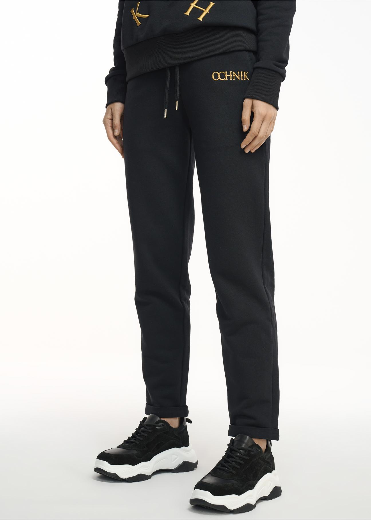 Czarne spodnie dresowe damskie SPODT-0065-99(Z22)