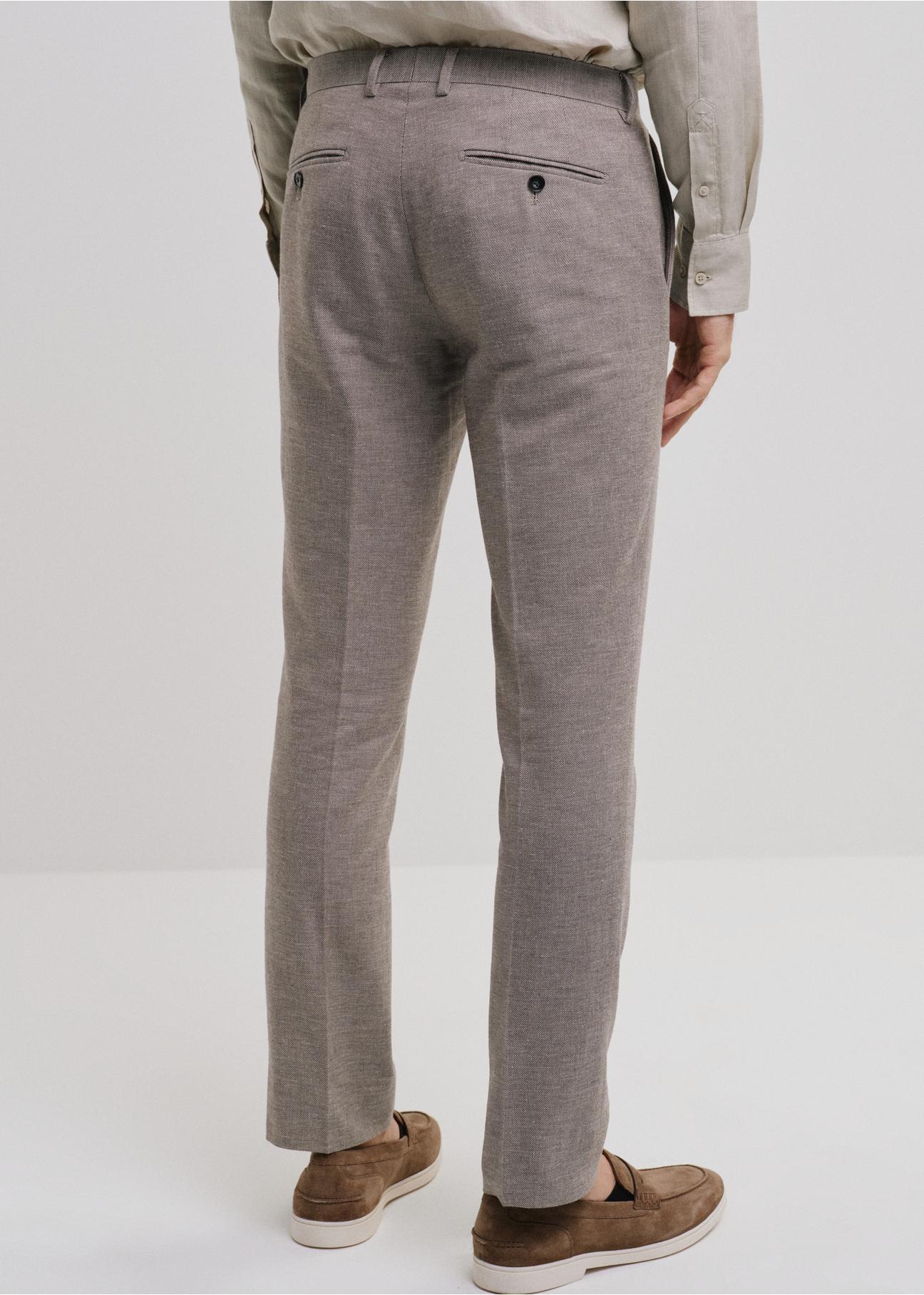Beżowe spodnie garniturowe męskie SPOMT-0098-81(W24)