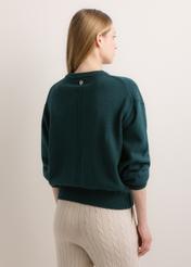 Turkusowy sweter damski oversize SWEDT-0280-7F(Z26), widok produktu z tyłu na modelu. Widoczna połowa sylwetki.