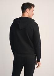 Czarna bluza męska z kapturem BLZMT-0074-99(Z25), widok produktu z tyłu na modelu. Widoczna połowa sylwetki.