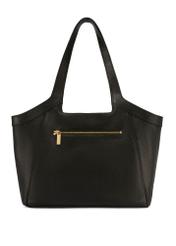 Duża skórzana torebka damska TORES-1205-9I(W26) - widok produktu z tyłu, na białym tle. 