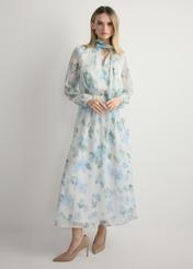 Kremowa sukienka damska w kwiaty SUKDT-0265-7P(W26), widok produktu z przodu na modelce. Widoczna cała sylwetka.