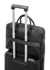 Czarna skórzana torba na laptopa TORMS-0494-99(W26) - zbliżenie na detal, na walizce, na białym tle. 