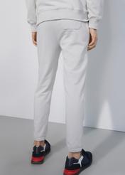 Kremowe spodnie dresowe męskie SPOMT-0085-66(W23)