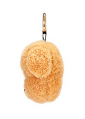 Brązowy brelok w kształcie psa BRELOK-210A-81(Z25), widok produktu z boku na białym tle.