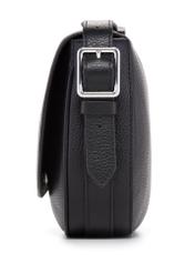 Czarna skórzana torebka damska na ramię TORES-1218-9I(W26), widok produktu z boku na białym tle.